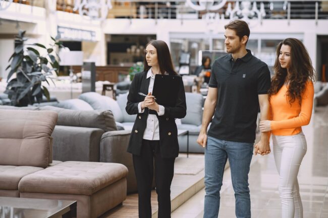 couple-with-salesman-furniture-store