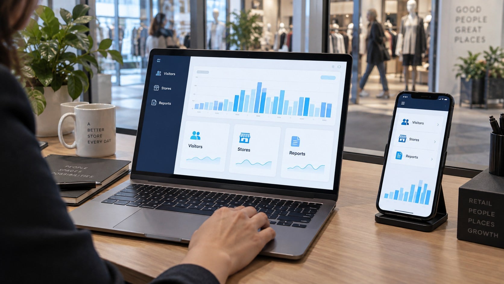 Illustrative retail analytics dashboards on a laptop and mobile phone